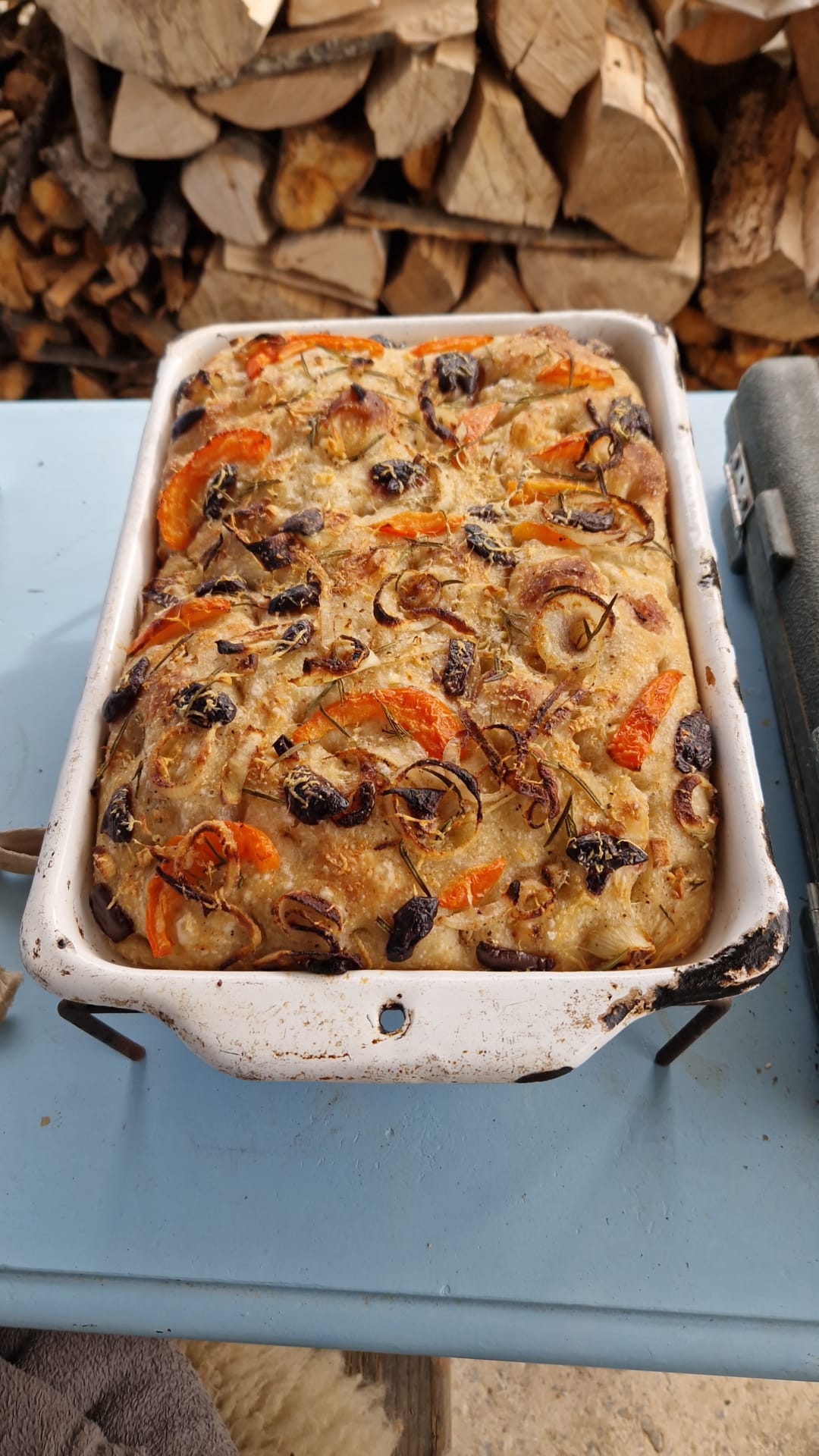 Freshly baked focaccia with rosemary, garlic and sea salt, golden brown and fluffy from the oven